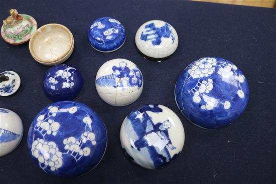 A collection of 19th century Chinese jar lids and two lidded pots